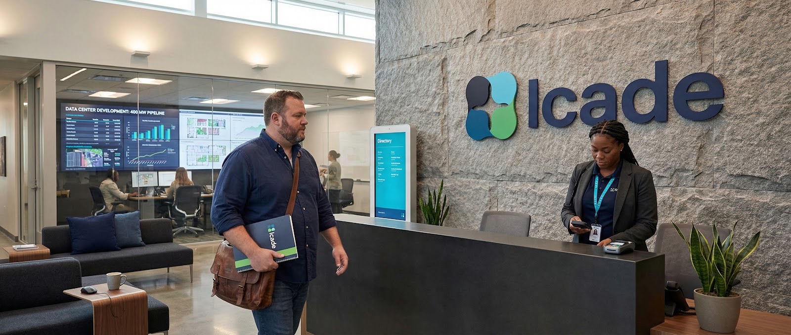 Réception Icade montrant un visiteur en interaction avec le personnel, mettant en valeur un design moderne et des affichages numériques.