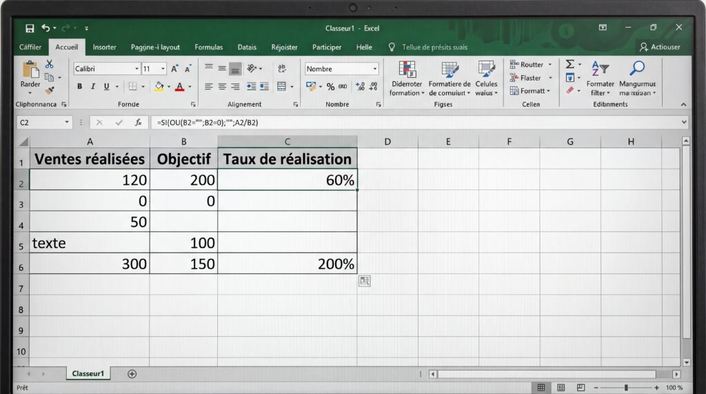Capture d'écran d'Excel montrant un tableau avec des ventes réalisées, un objectif et le taux de réalisation en pourcentage.